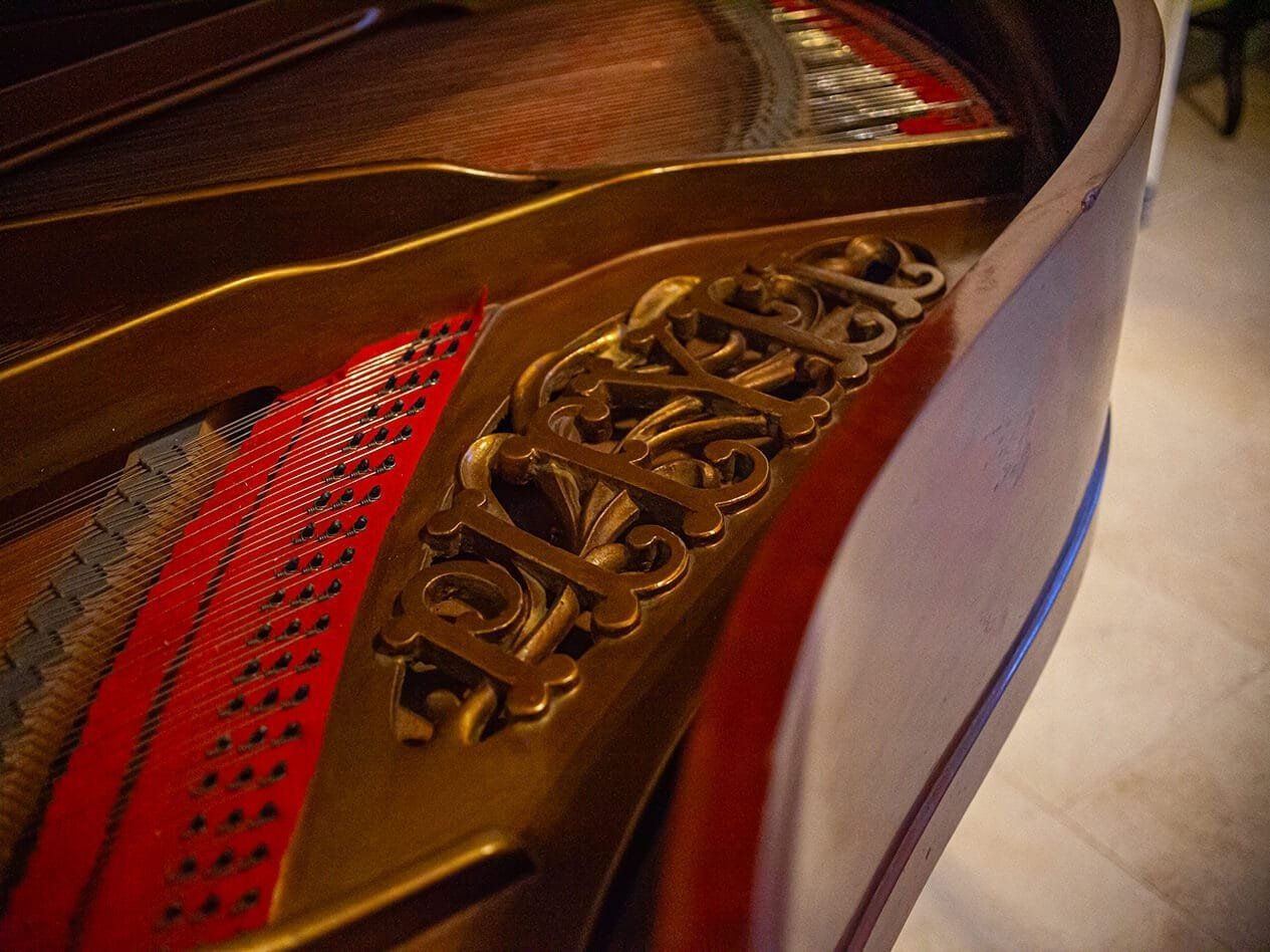 Openwork detail of an antique grand piano